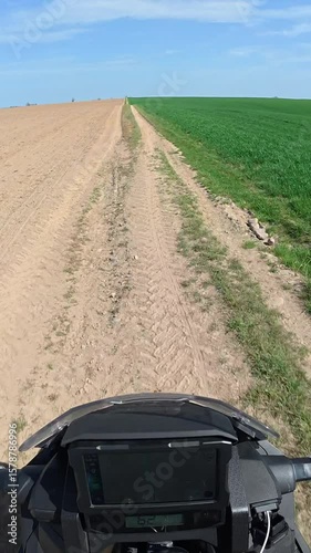Offroad Motorcycle driving fast on field road