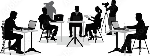 Silhouette of people working on laptops and being filmed in a studio environment with cameras around
