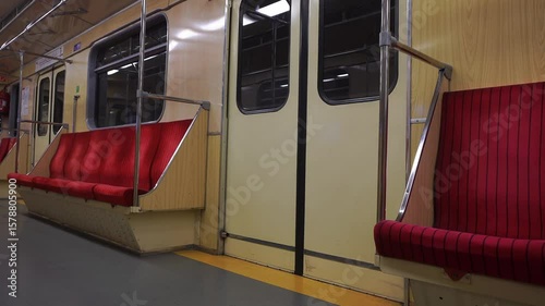 A video showcasing close-up views of worn, vintage seats from an old Soviet-era metro station, highlighting the passage of time and historical context.