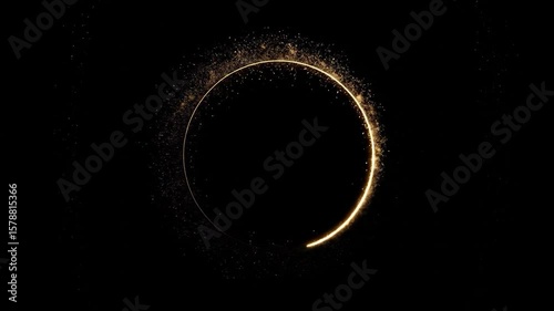 Glowing circle shape on black with gold dust