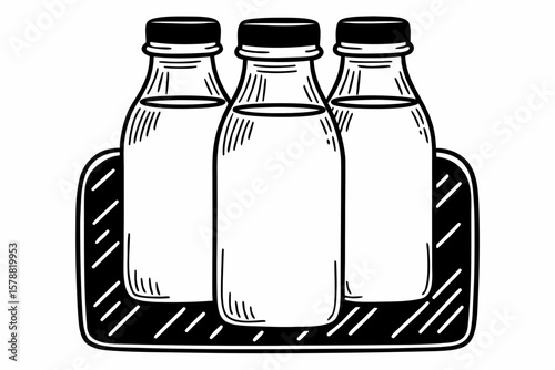 Three vintage milk bottles in a crate isolated on white background