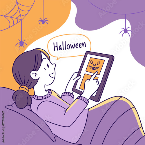 Girl using tablet with halloween theme while lying in bed with spider web and spiders hanging down nearby