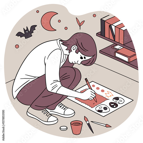 Person squatting and painting on paper with moon, bat, and bookshelf in the background at nighttime