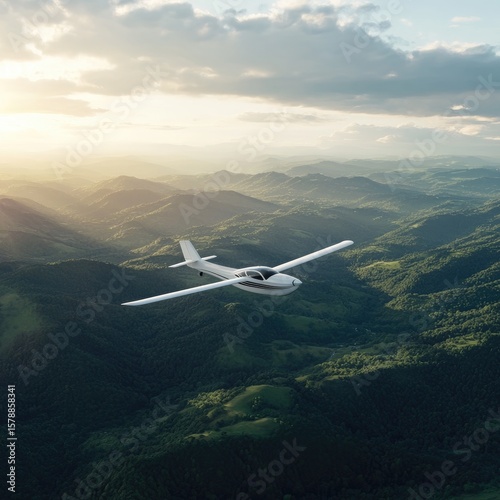 Small plane over mountain range sunrise