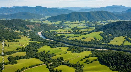 Expansive Green Valley with Winding River and Rolling Hills