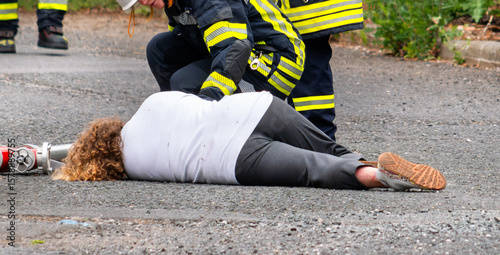 First aid measures by firefighters after an accident or medical emergency on the street