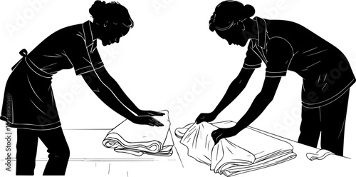 Silhouettes of Hotel Housekeepers Folding Laundry or Towels