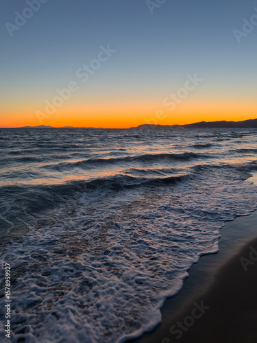 Fototapeta Naklejka Na Ścianę i Meble -  Tuscany, Italy. Amazing view of the shore during summer time. Sunset time. Italian sandy beaches at sunset