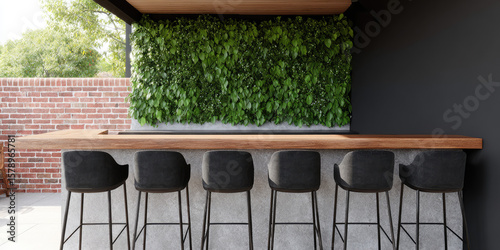 A row of modern bar stools sits at a wooden counter with a green plant wall behind. Outdoor seating, modern design