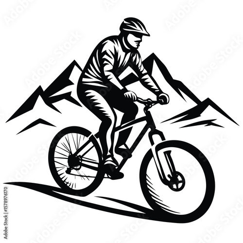 Mountain biker riding downhill with peaks mountain biking