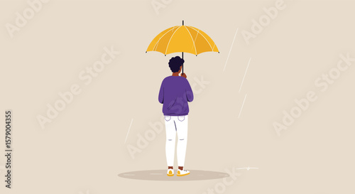 A person stands under a yellow umbrella in the rain, seeking protection from the storm and reflecting on the weather