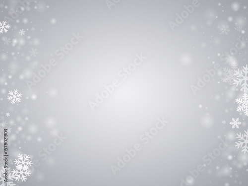 Snowflakes over gray sky background