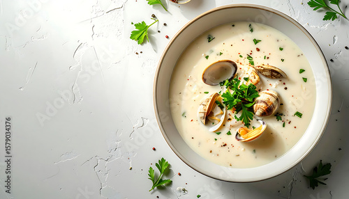Photorealistic top-down view of Clam Chowder on a minimalist plate