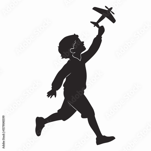 Silhouette of a young boy running with a toy airplane held high in his outstretched hand against a white background