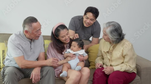 A multigenerational family gathers together, sharing warmth and love as they celebrate a special family moment with newborn. Their care strengthen bond between generations, embracing positive emotions