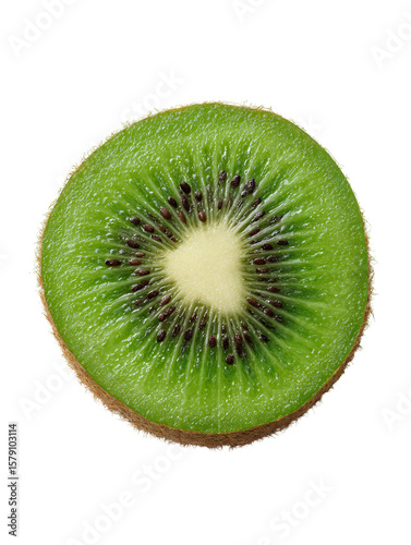Close up shot of a single kiwi slice with black seeds on a black background studio shot