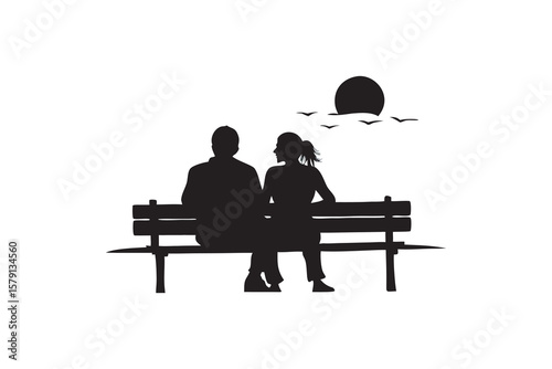 Silhouette of Couple Sitting on a Bench at Sunset