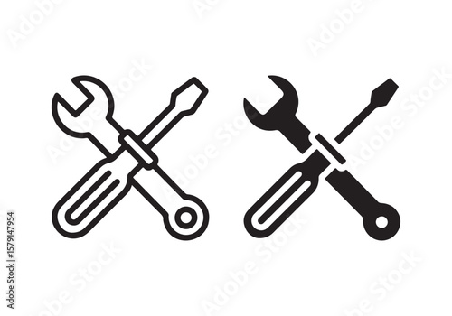Two crossed tools a wrench and a screwdriver icon isolated on white background
