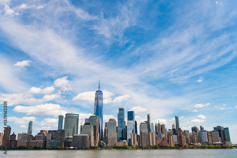Fototapeta premium A view of the New York financial district fom Paulus Hook Pier in Jersey City, New Jersey.New York, United States. Manhattan New York NY NYC Skyline. Lower Manhattan and One World Trade Center in New