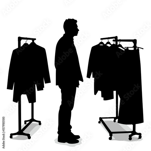 Man contemplating clothing options while standing in retail store  