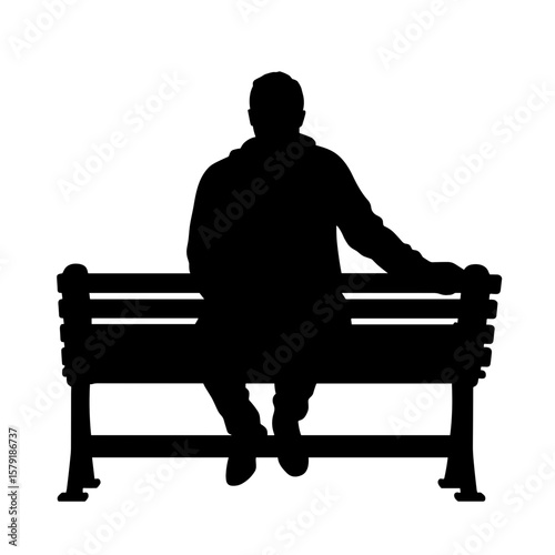 Silhouette of man sitting on park bench in contemplative pose  