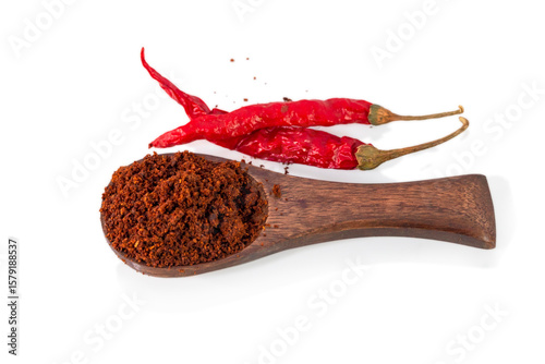 Fototapeta Naklejka Na Ścianę i Meble -  Red chilli and chilli powder in wooden spoon isolated on white background.