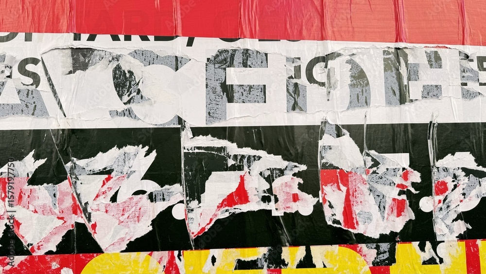 Fototapeta premium Torn street posters creating abstract urban artwork with film aesthetic