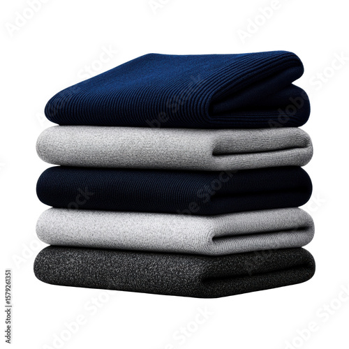 Neatly folded sweaters in a stacked arrangement