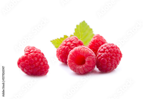 Sweet raspberry with leaves on white backgrounds.