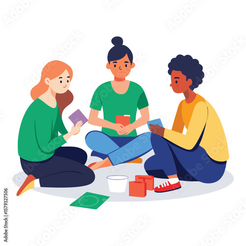 Friends sitting cross-legged, happily playing a card game together, enjoying leisure time.