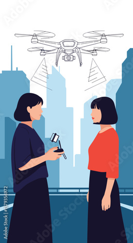 Two women observing a drone flying above a city skyline at dusk with architectural buildings in the background
