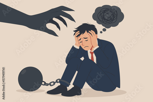 Businessman chained by anxiety, depression, fear of failure, stress, burnout, negative thoughts, mental health disorder, phobia, struggle, dark shadow hand metaphor