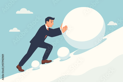 Businessman pushing large snowball uphill, snowball effect metaphor for financial growth, risk, investment, mistake, accumulation, business challenge, opportunity, progress