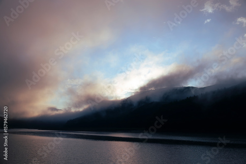 Dawn with thick fog in the mountains, Carpathians