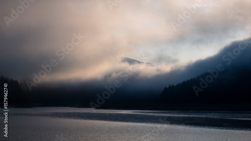 Dawn with thick fog in the mountains, Carpathians