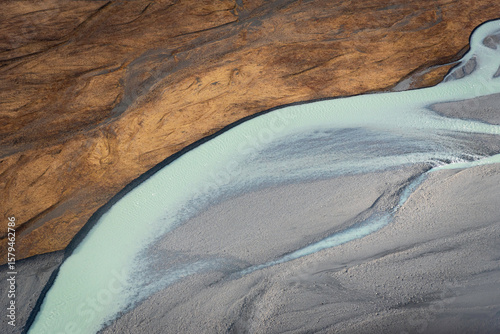 The contrast of colors and shapes in the Tasman River within the Southern Alps of New Zealand.