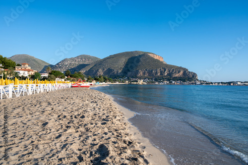 Fototapeta Naklejka Na Ścianę i Meble -  Sunny day on seaside vacation destination, Mondello Beach, near Palermo in Sicily with fine, golden sand, turquoise waters and charming villas, South of Italy
