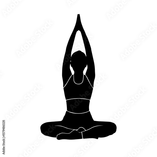 Woman practicing yoga in seated position with hands raised  