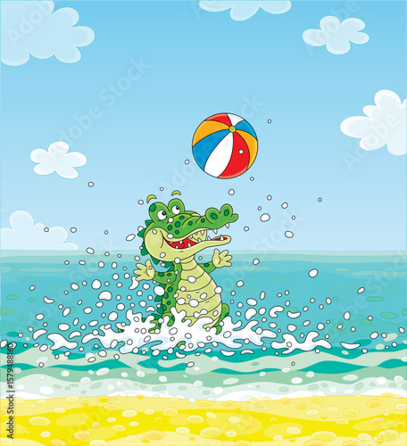 Funny green crocodile merrily playing a colorful striped ball and splashing in water on a summer beach of a tropical sea island, vector cartoon illustration
