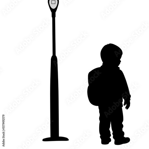 Silhouette of child standing beside a parking meter in urban setting  
