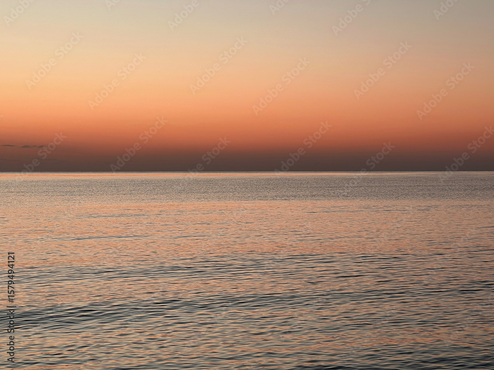 Obraz premium Vivid sunrise over the sea. Peaceful and captivating atmosphere. Nature background, relaxation concept, travel theme and inspirational visual