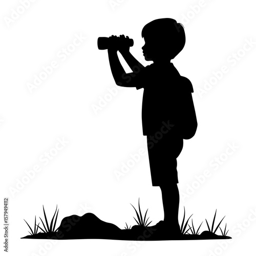 Boy holding binoculars while exploring outdoors in silhouette  