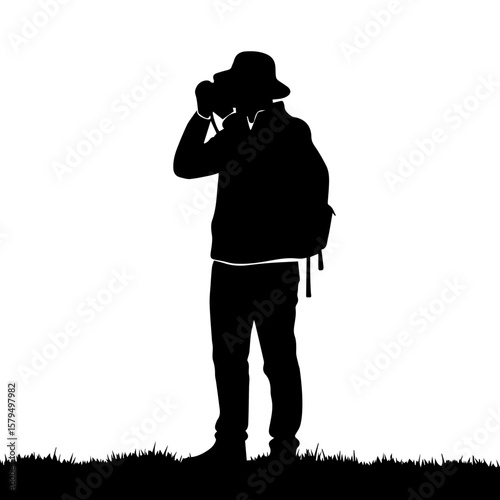 Silhouette of a man taking photos with camera in nature  