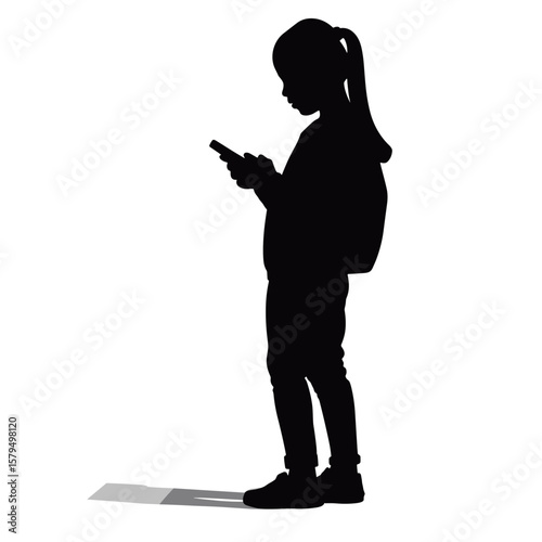 Girl standing with backpack and using smartphone in silhouette  