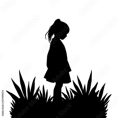 Young girl silhouette standing among tall plants in a garden  