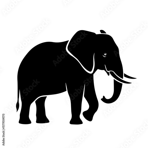 Silhouette of an elephant walking with trunk raised in profile  