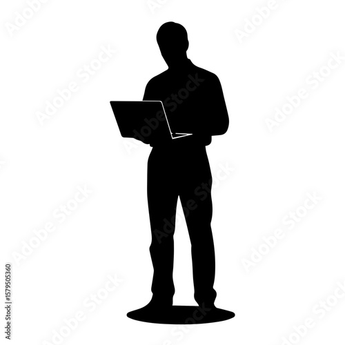 Silhouette of man standing and working on laptop  