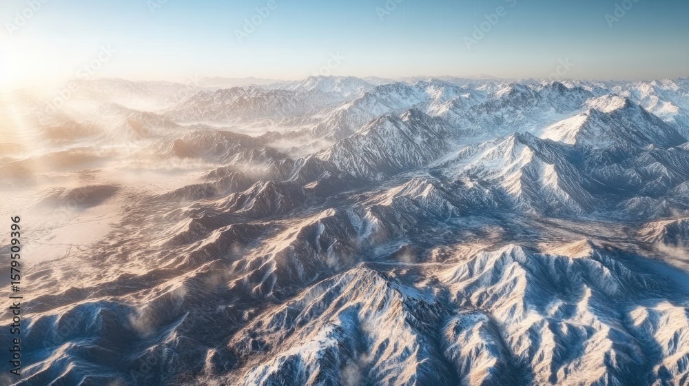 Obraz premium High-altitude view of snow-capped mountain ranges at sunrise