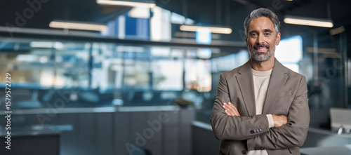 Happy middle aged older professional business man, smiling mature executive ceo manager, mature male entrepreneur, rich confident business owner standing in office looking at camera, portrait.