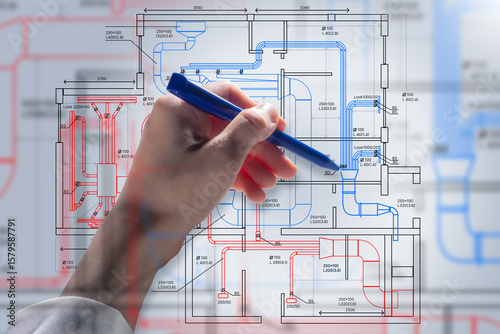 Drawings of ventilation system. Scheme of vents communications at hand. Drawings of air handling unit. Plan of air-conditioning ducts. Designer draws industrial utilities. Design of ventilation